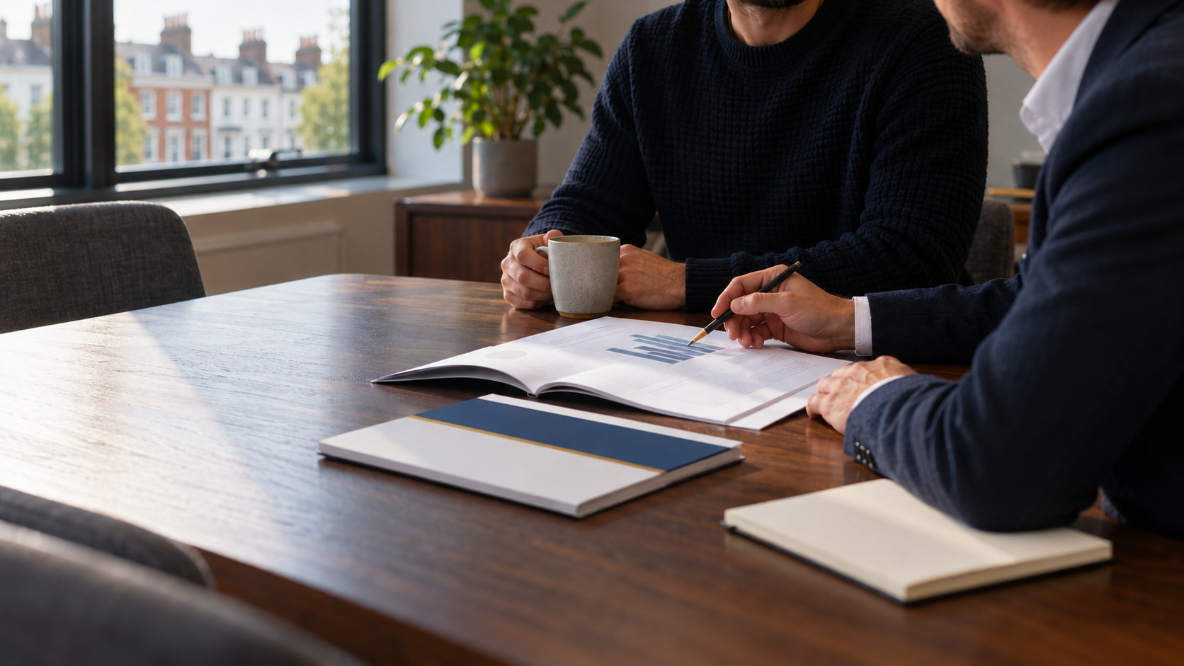 A finance director going through a printed pack with a business owner